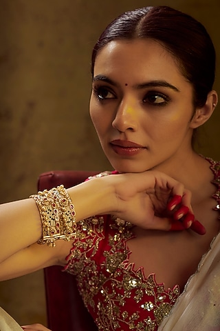 Gold Finish Kundan Polki & Multi-Colored Stone Temple Bangles (Set of 2) by VASTRAA Jewellery