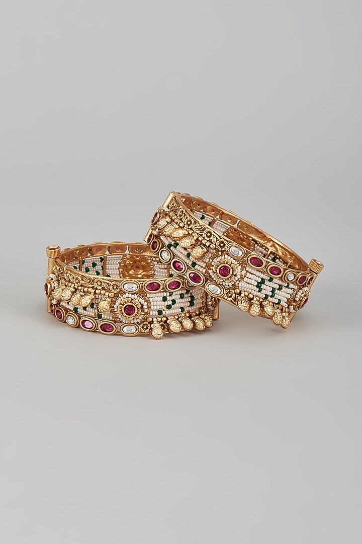 Gold Finish Kundan Polki & Multi-Colored Stone Temple Bangles (Set of 2) by VASTRAA Jewellery at Pernia's Pop Up Shop