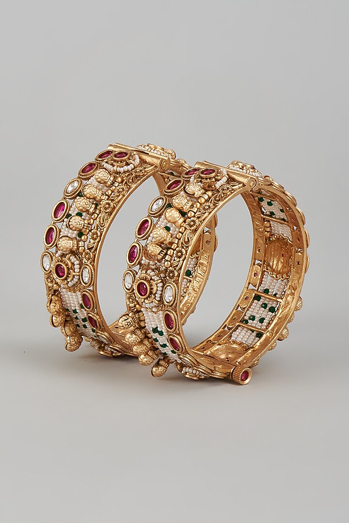 Gold Finish Kundan Polki & Multi-Colored Stone Temple Bangles (Set of 2) by VASTRAA Jewellery at Pernia's Pop Up Shop
