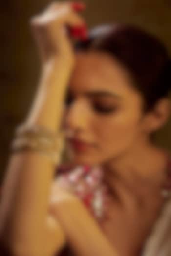 Gold Finish Kundan Polki & Multi-Colored Stone Temple Bangles (Set of 2) by VASTRAA Jewellery at Pernia's Pop Up Shop