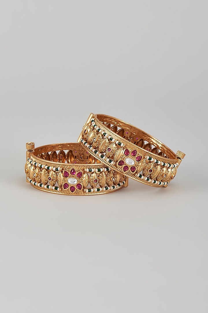 Gold Finish Kundan Polki & Multi-Colored Stone Temple Bangles (Set of 2) by VASTRAA Jewellery at Pernia's Pop Up Shop
