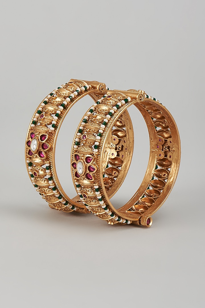 Gold Finish Kundan Polki & Multi-Colored Stone Temple Bangles (Set of 2) by VASTRAA Jewellery at Pernia's Pop Up Shop