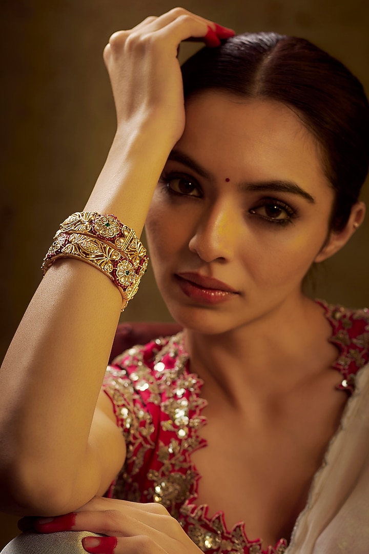 Gold Finish Kundan Polki & Multi-Colored Stone Temple Bangles (Set of 2) by VASTRAA Jewellery at Pernia's Pop Up Shop