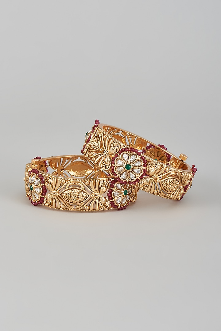 Gold Finish Kundan Polki & Multi-Colored Stone Temple Bangles (Set of 2) by VASTRAA Jewellery at Pernia's Pop Up Shop