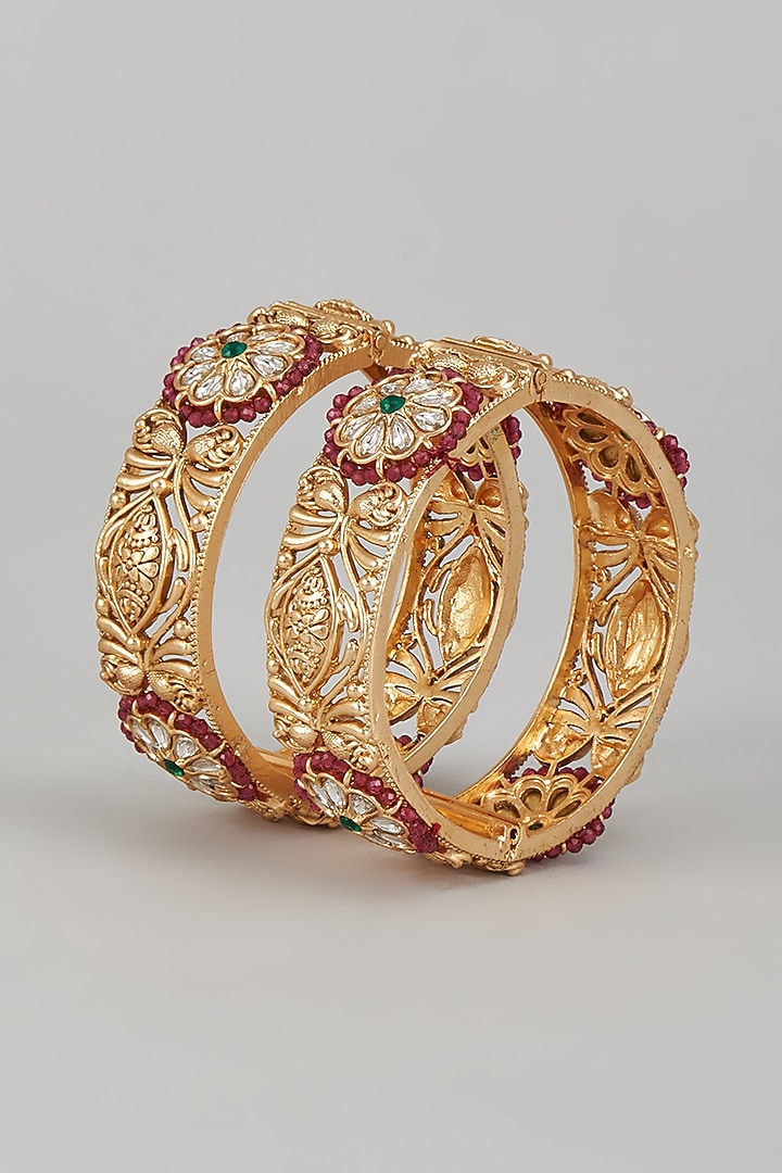Gold Finish Kundan Polki & Multi-Colored Stone Temple Bangles (Set of 2) by VASTRAA Jewellery at Pernia's Pop Up Shop