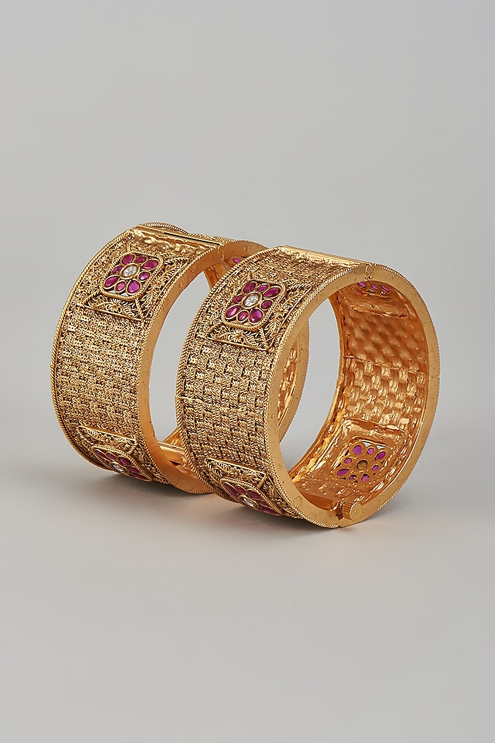 Gold Finish Kundan Polki & Multi-Colored Stone Temple Bangles (Set of 2) by VASTRAA Jewellery at Pernia's Pop Up Shop