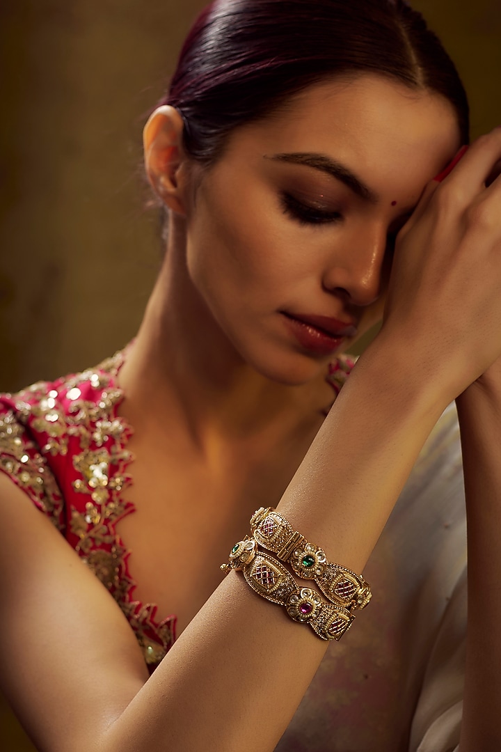 Gold Finish Kundan Polki & Multi-Colored Stone Temple Bangles (Set of 2) by VASTRAA Jewellery at Pernia's Pop Up Shop