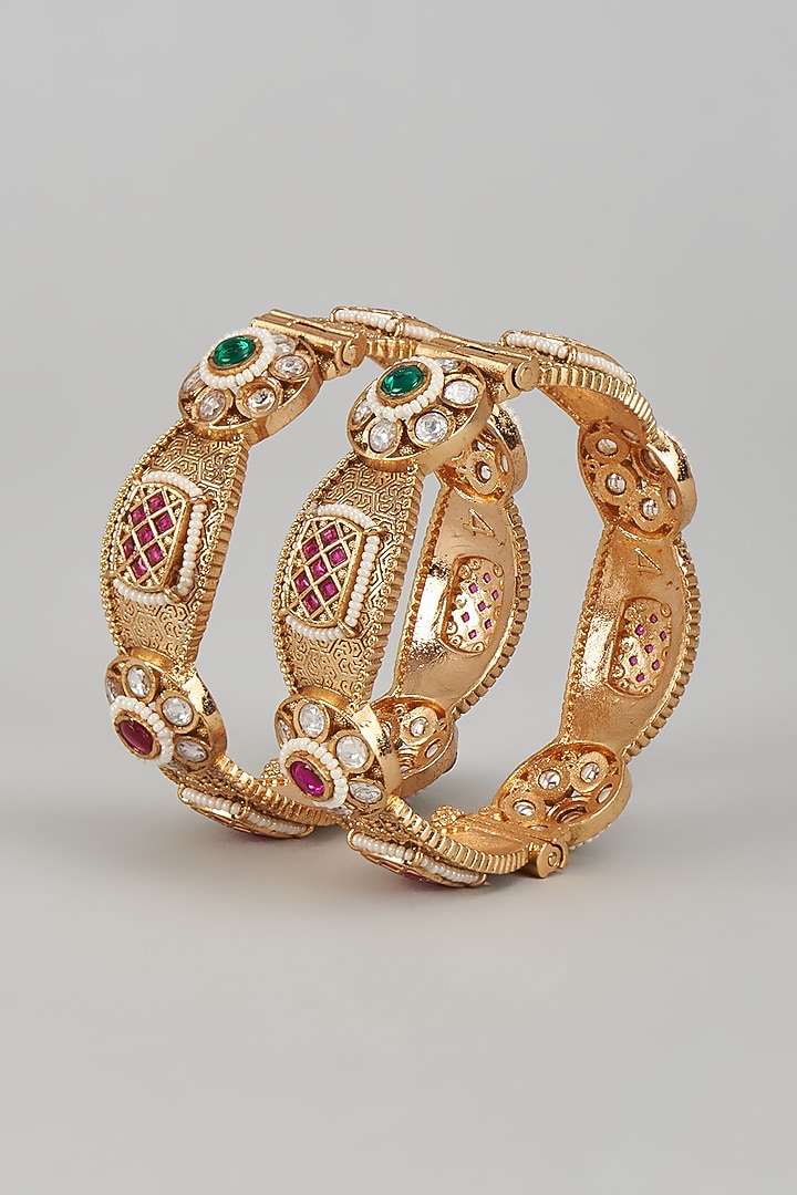 Gold Finish Kundan Polki & Multi-Colored Stone Temple Bangles (Set of 2) by VASTRAA Jewellery at Pernia's Pop Up Shop