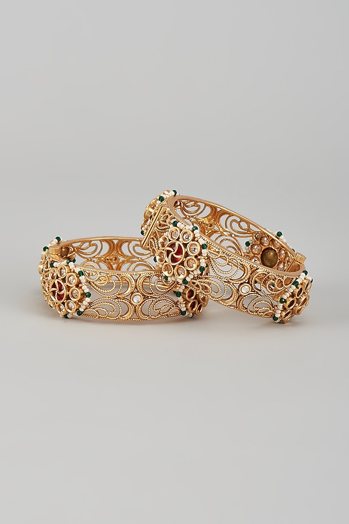 Gold Finish Kundan Polki & Multi-Colored Stone Temple Bangles (Set of 2) by VASTRAA Jewellery at Pernia's Pop Up Shop