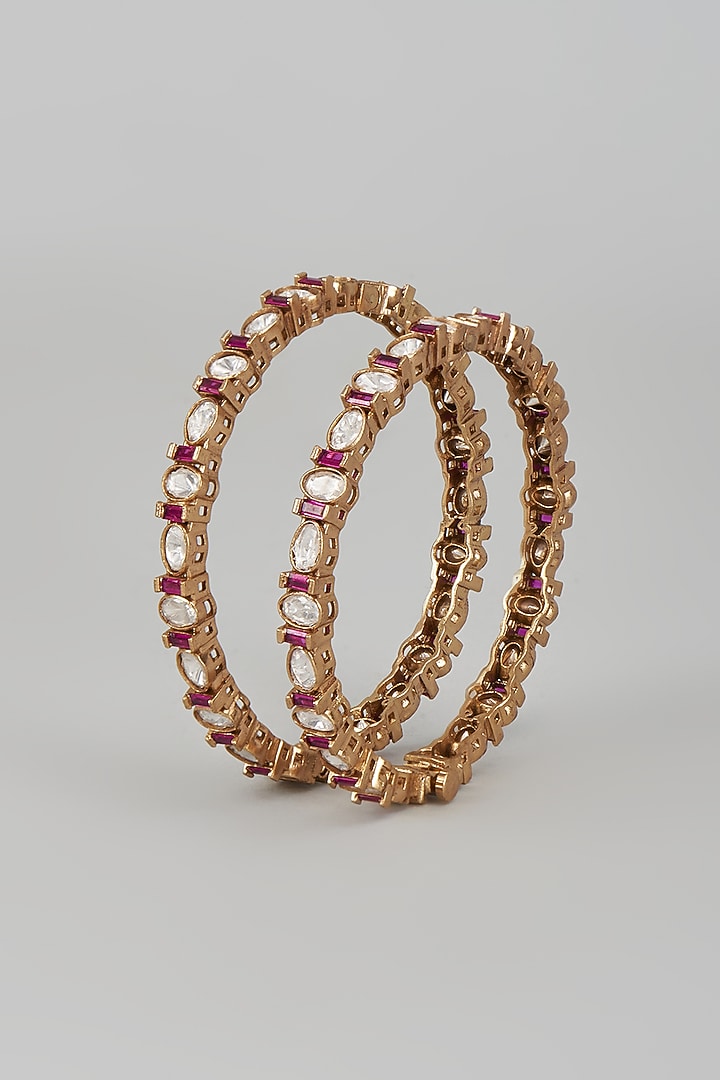 Gold Finish Kundan Polki & Ruby Bangles (Set Of 2) by VASTRAA Jewellery at Pernia's Pop Up Shop
