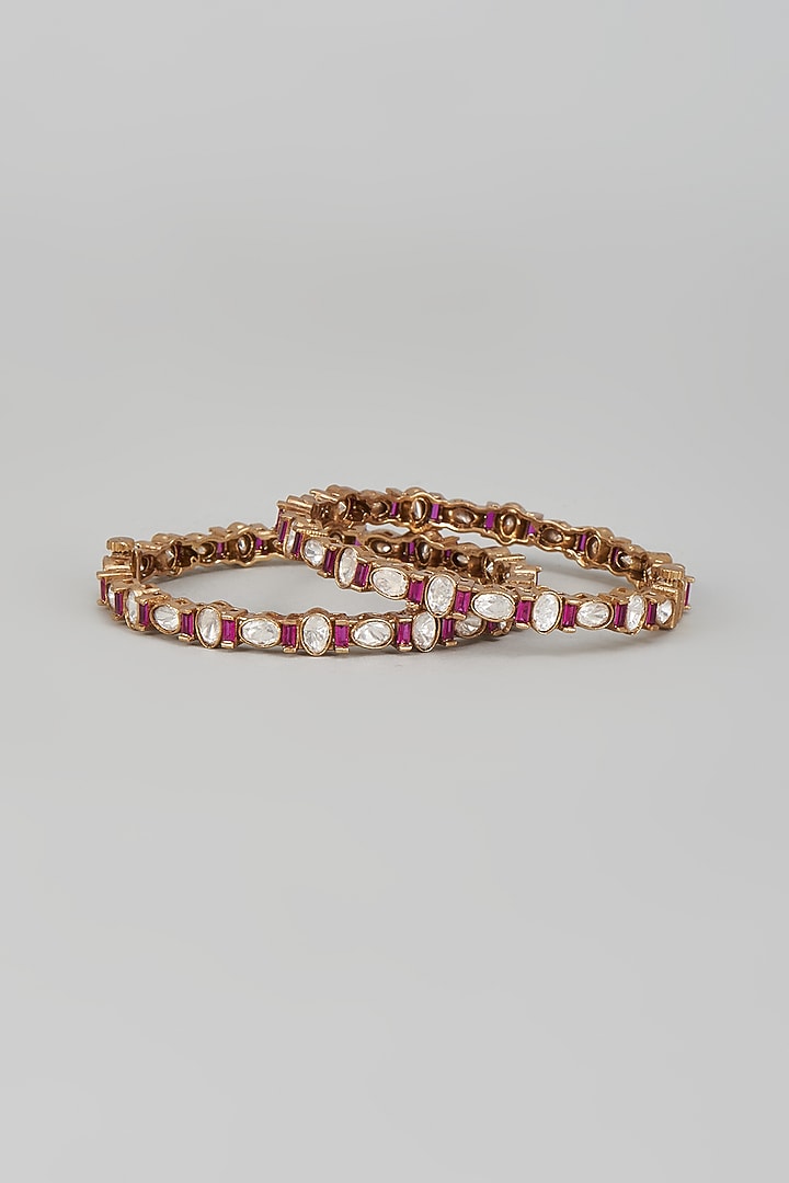 Gold Finish Kundan Polki & Ruby Bangles (Set Of 2) by VASTRAA Jewellery at Pernia's Pop Up Shop