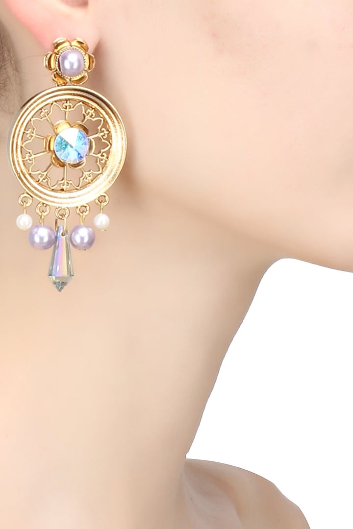 Gold finish pearl round earrings by Valliyan By Nitya Arora