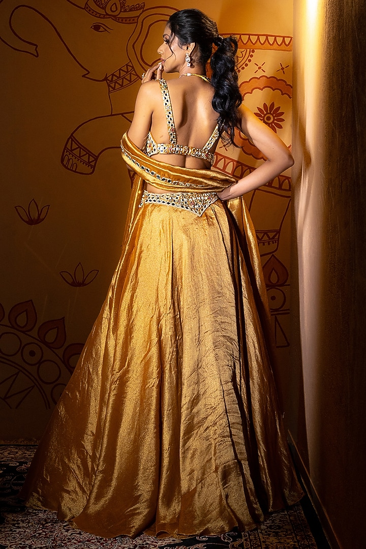 Antique Gold Tissue Mirror Embroidered Wedding Lehenga Set by VANA ETHNICS at Pernia's Pop Up Shop