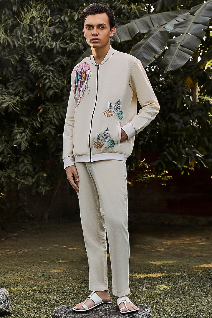 Ivory Handwoven Cotton Linen Printed & Embroidered Bomber Jacket by VAANI BESWAL MEN