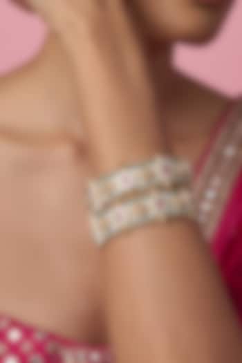 Gold Finish Kundan Polki & Multi-Colored Stone Temple Bangles (Set Of 2) by VASTRAA Jewellery at Pernia's Pop Up Shop