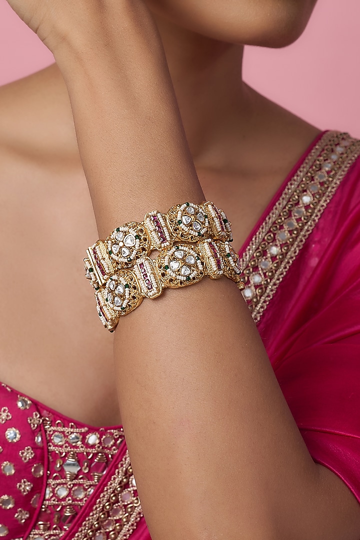 Gold Finish Kundan Polki & Multi-Colored Stone Temple Bangles (Set Of 2) by VASTRAA Jewellery at Pernia's Pop Up Shop