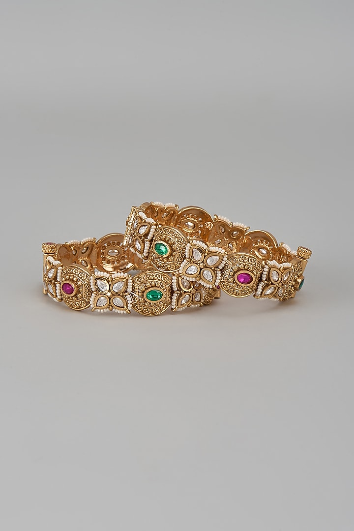 Gold Finish Kundan Polki & Multi-Colored Stone Temple Bangles (Set Of 2) by VASTRAA Jewellery at Pernia's Pop Up Shop