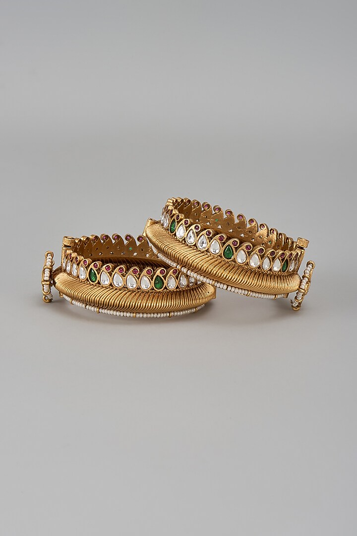 Gold Finish Kundan Polki & Green Stone Temple Bangles (Set Of 2) by VASTRAA Jewellery at Pernia's Pop Up Shop