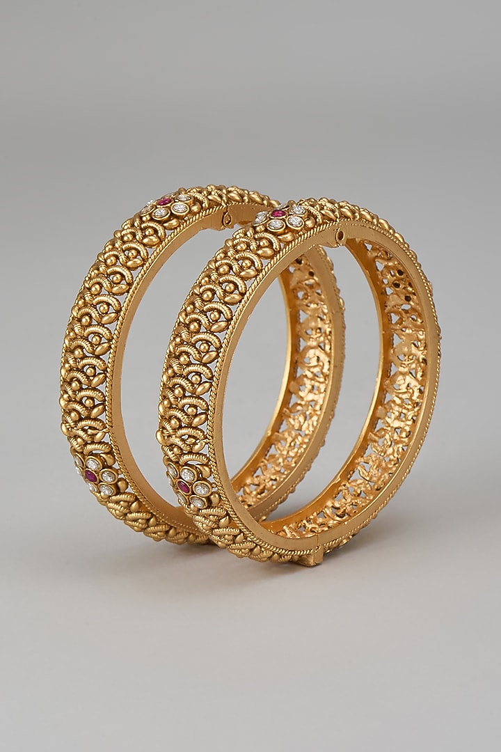 Gold Finish Kundan Polki & Red Stone Temple Bangles (Set Of 2) by VASTRAA Jewellery at Pernia's Pop Up Shop