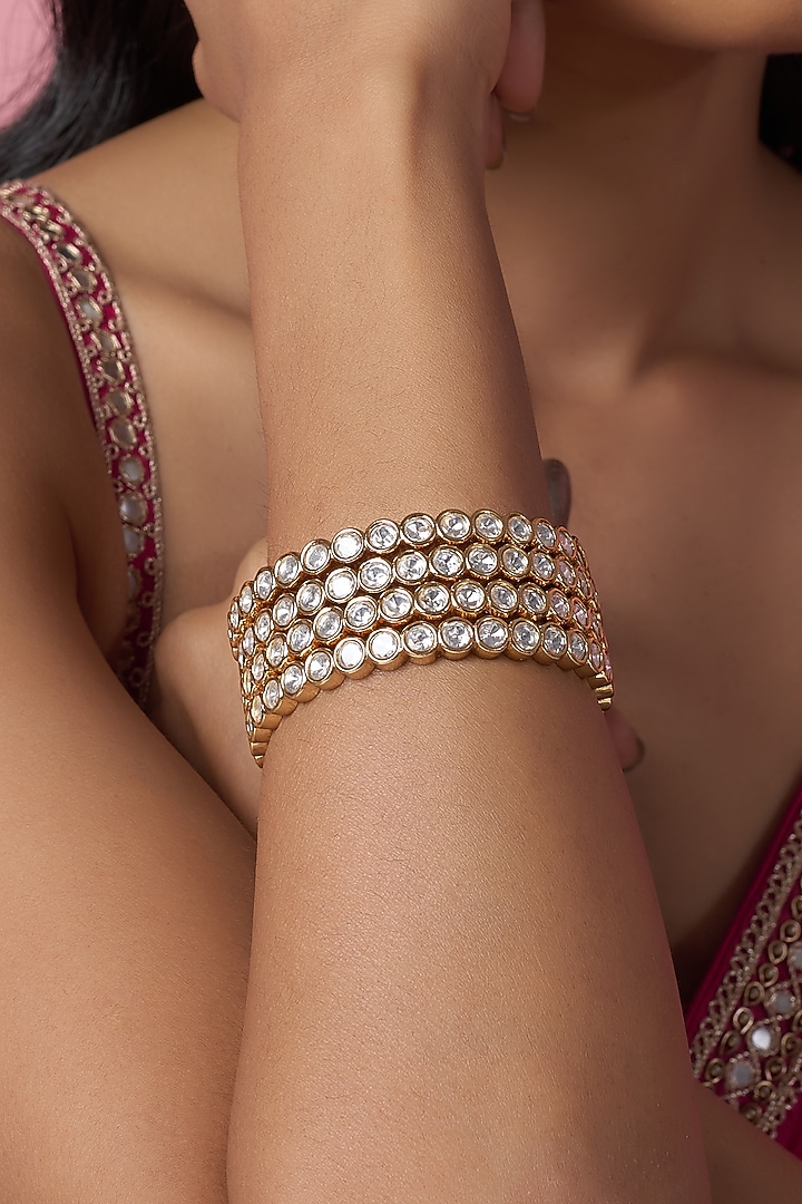 Gold Finish Kundan Polki Bangles (Set Of 4) by VASTRAA Jewellery at Pernia's Pop Up Shop