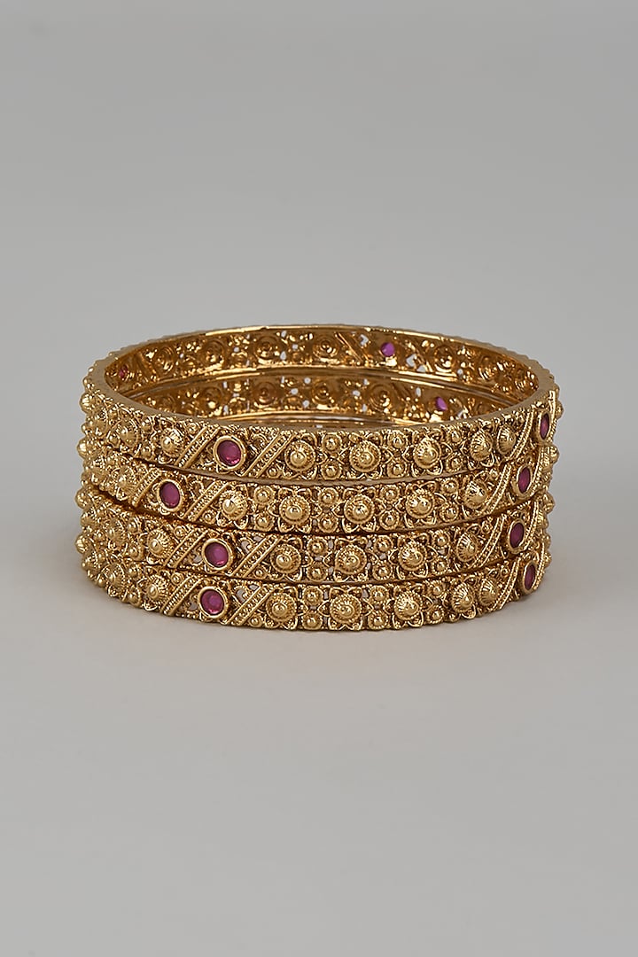 Gold Finish Kundan Polki & Red Stone Temple Bangles (Set Of 4) by VASTRAA Jewellery at Pernia's Pop Up Shop