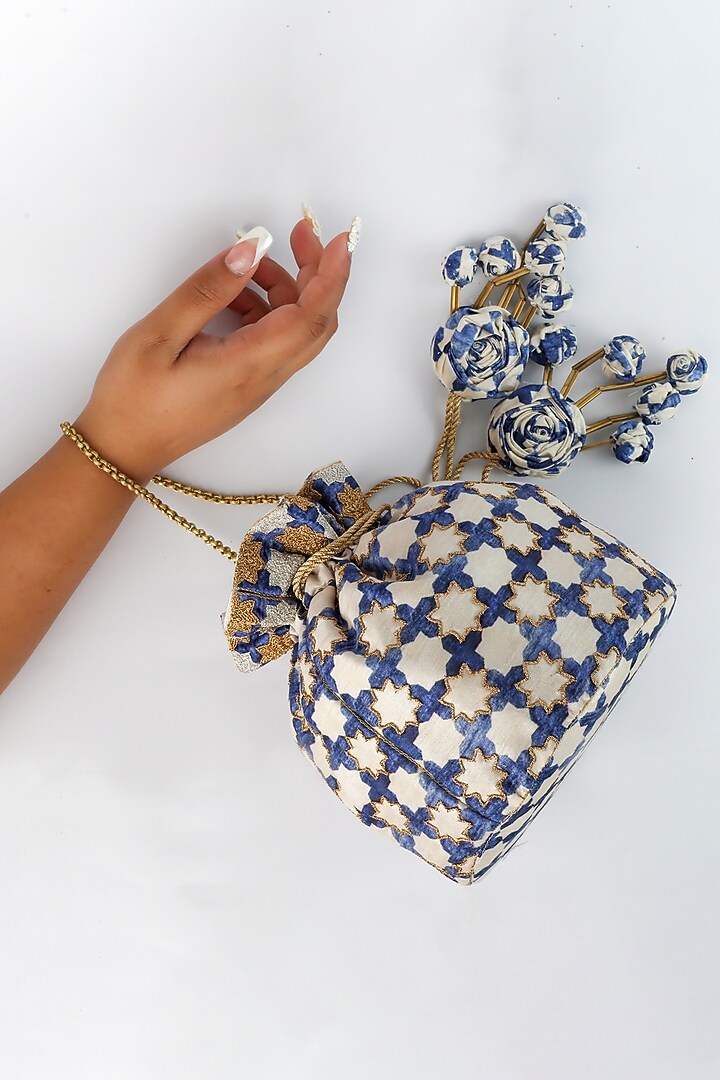 Off White Embroidered Potli With Handmade Tassels by Vareli Bafna Designs at Pernia's Pop Up Shop
