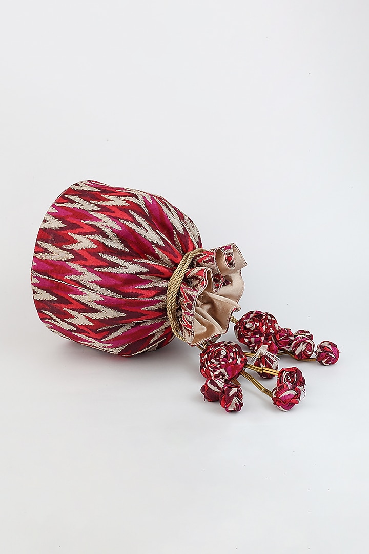 Red Ikat Printed Potli With Handmade Tassels by Vareli Bafna Designs at Pernia's Pop Up Shop
