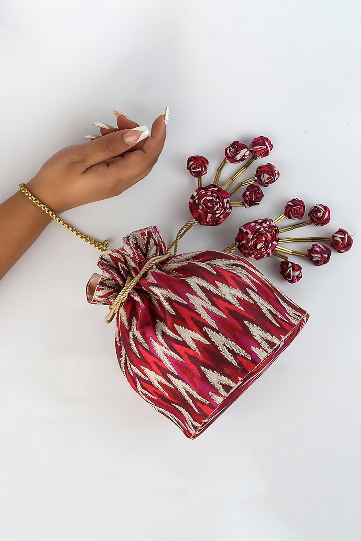 Red Ikat Printed Potli With Handmade Tassels by Vareli Bafna Designs at Pernia's Pop Up Shop