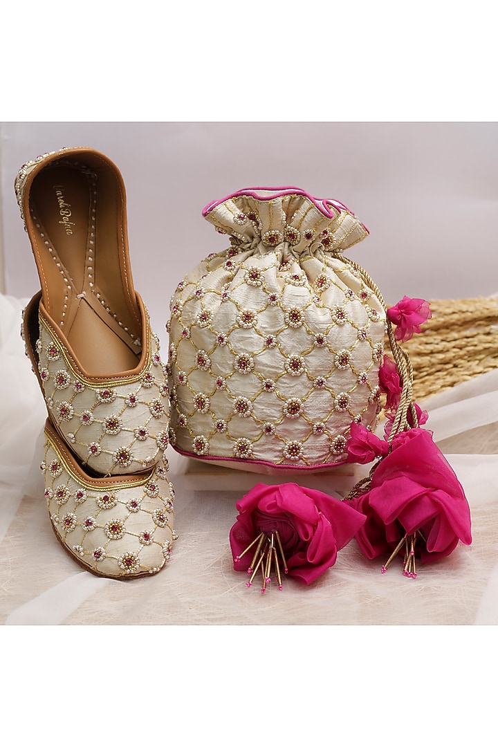 Pearl White Embroidered Potli With Floral Tassels by Vareli Bafna Designs at Pernia's Pop Up Shop