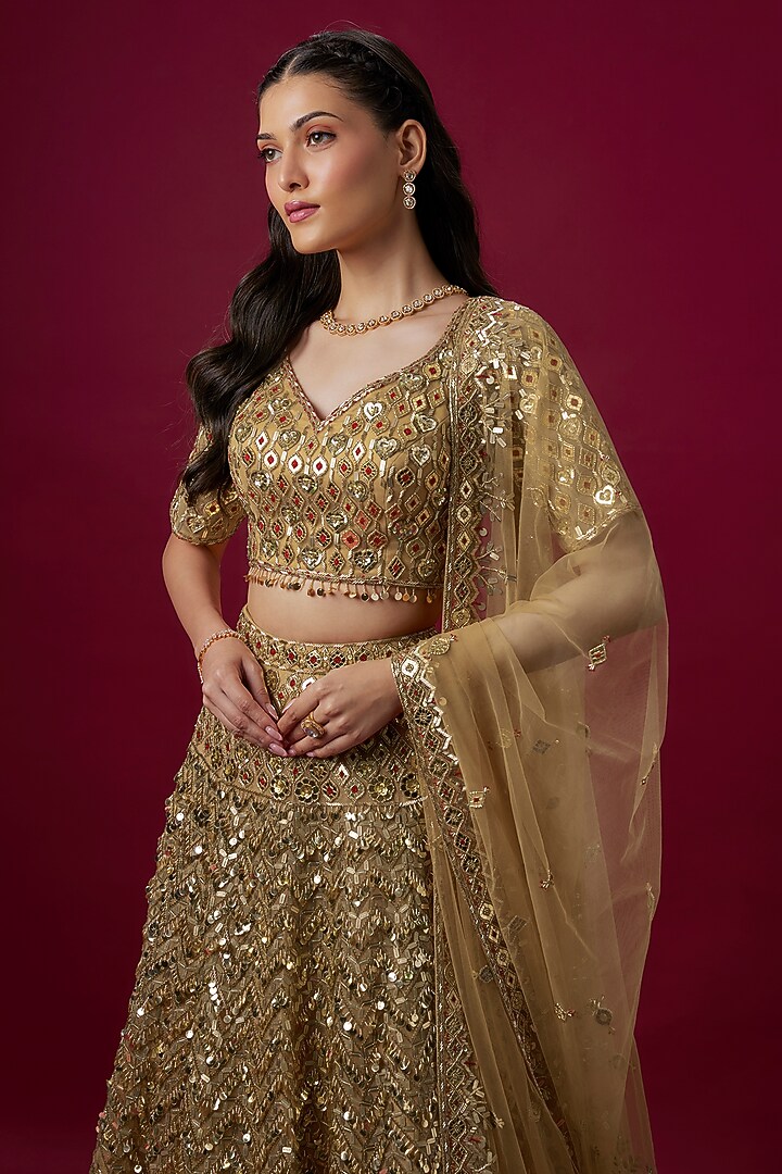 Gold Net Zari Embroidered Bridal Lehenga Set by V. Bridals at Pernia's Pop Up Shop