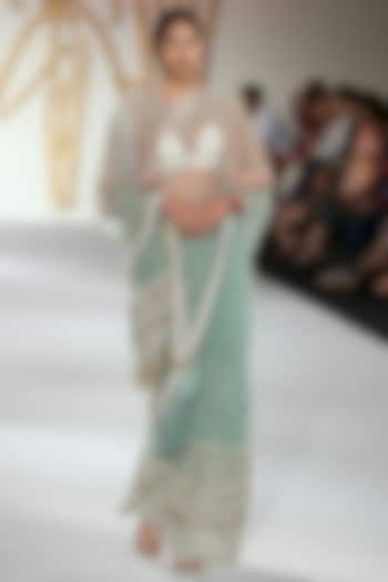 Pistachio embroidered saree and cape set available only at Pernia's Pop Up Shop.