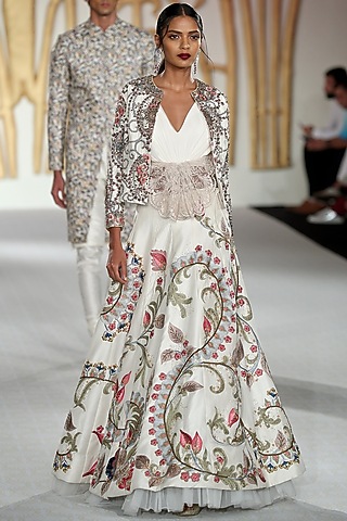 Ivory Embroidered Asymmetrical Lehenga, Blouse and Jacket Set by Varun Bahl