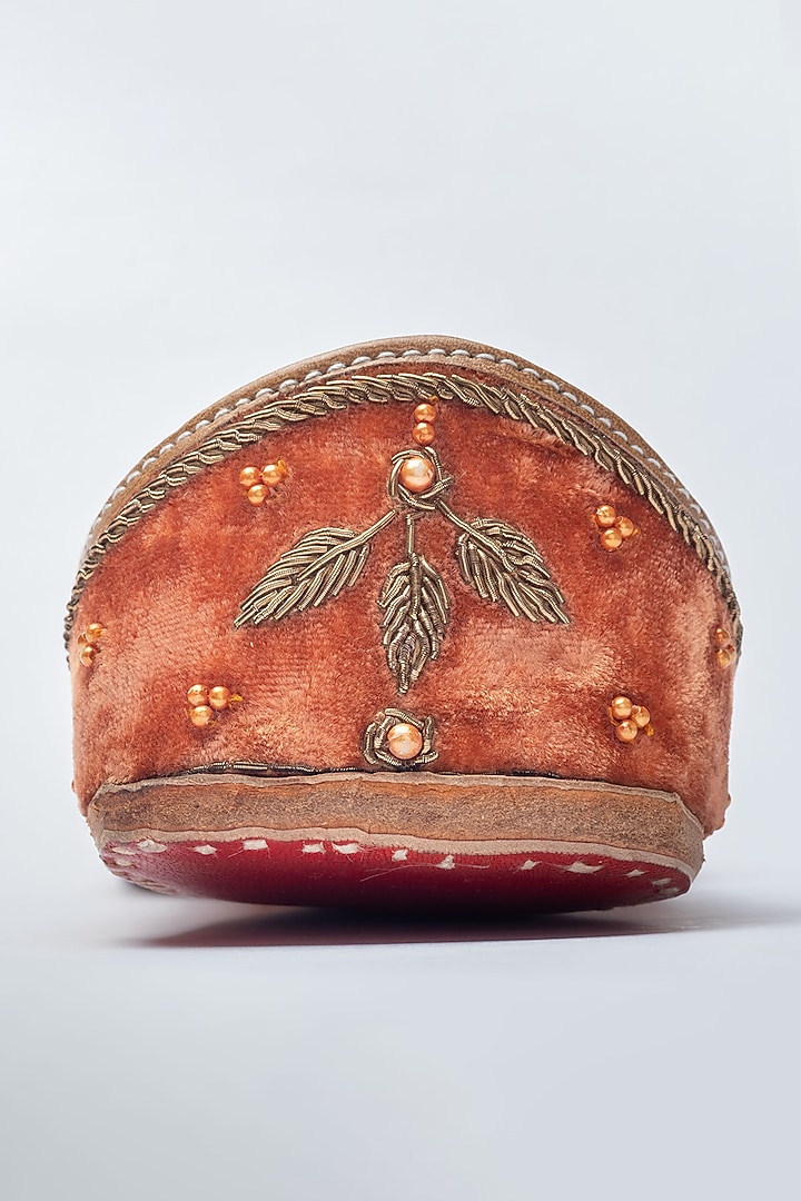 Orange embroidered zardozi work and pearl juttis available only at Pernia's Pop Up Shop.