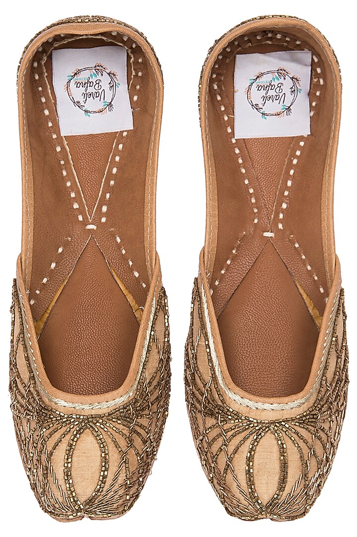 Golden zardozi and kathdana embroidered juttis available only at Pernia's Pop Up Shop.