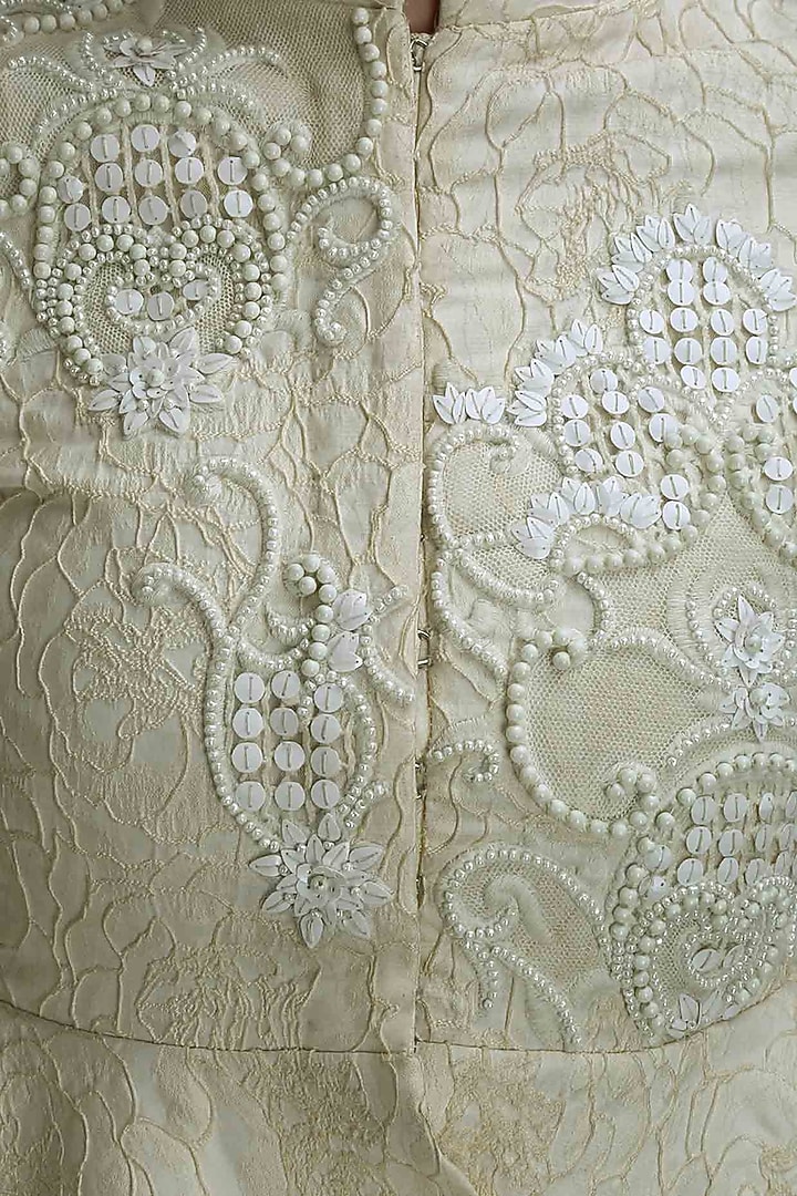 Ivory embroidered asymmetrical peplum top available only at Pernia's Pop Up Shop.