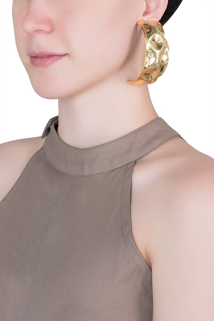 Gold plated textured hoop earrings by Valliyan by Nitya Arora
