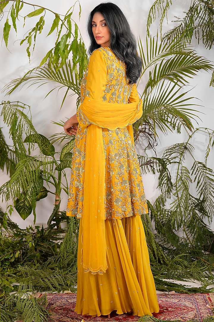 Mustard Hand Embroidered Peplum Kurta Set by Vidushi Gupta at Pernia's Pop Up Shop