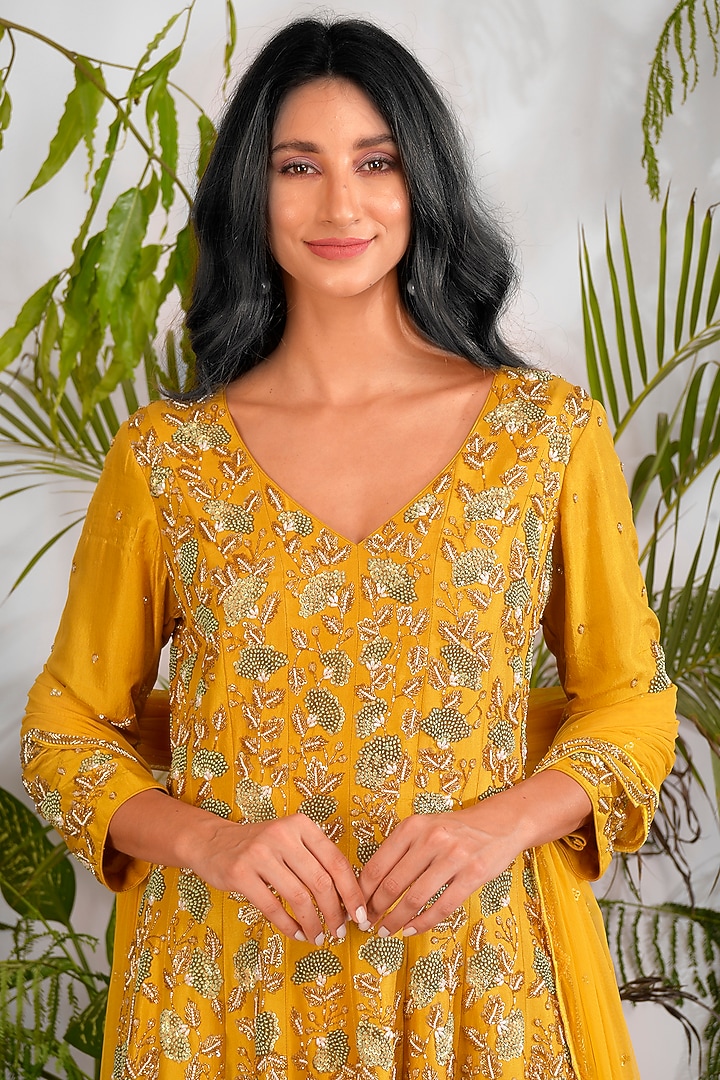 Mustard Hand Embroidered Peplum Kurta Set by Vidushi Gupta at Pernia's Pop Up Shop