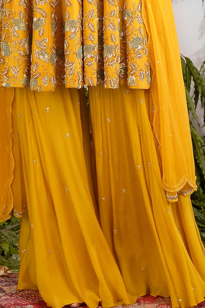 Mustard Hand Embroidered Peplum Kurta Set by Vidushi Gupta at Pernia's Pop Up Shop
