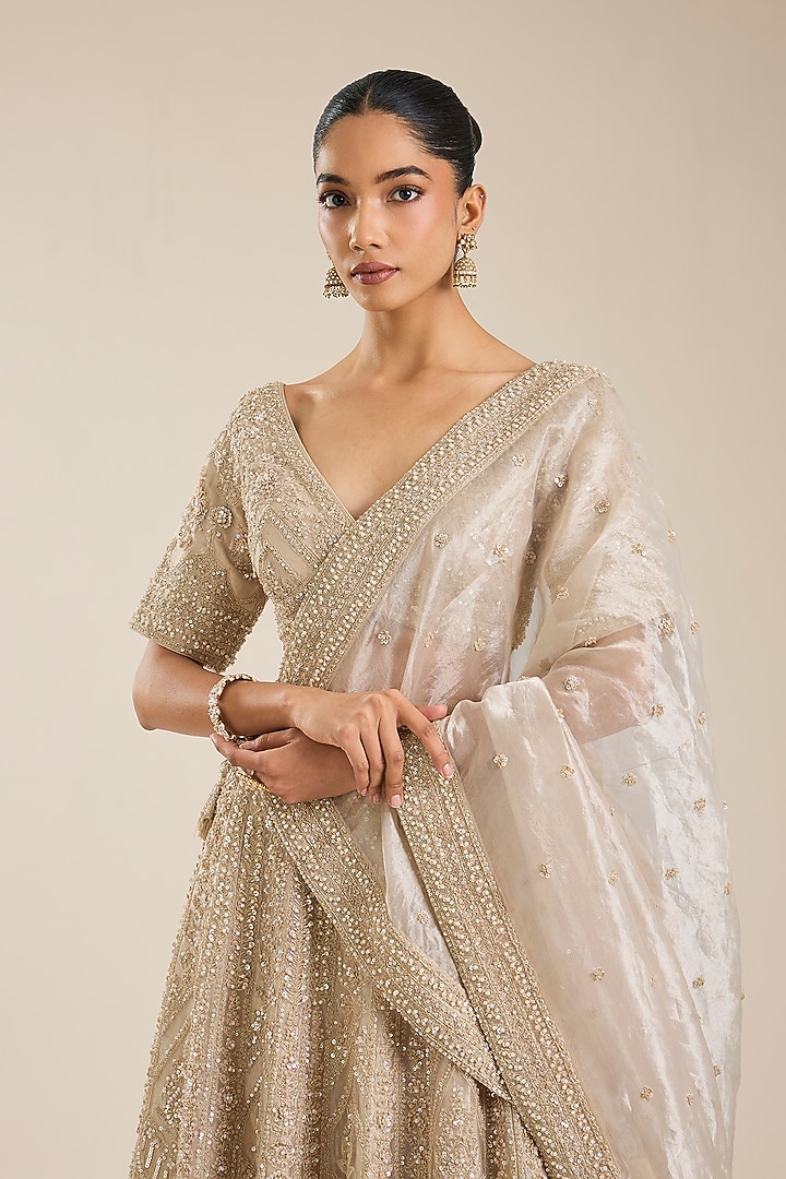 Champagne Tissue Sequins Embroidered Bridal Lehenga Set by Vedant G at Pernia's Pop Up Shop