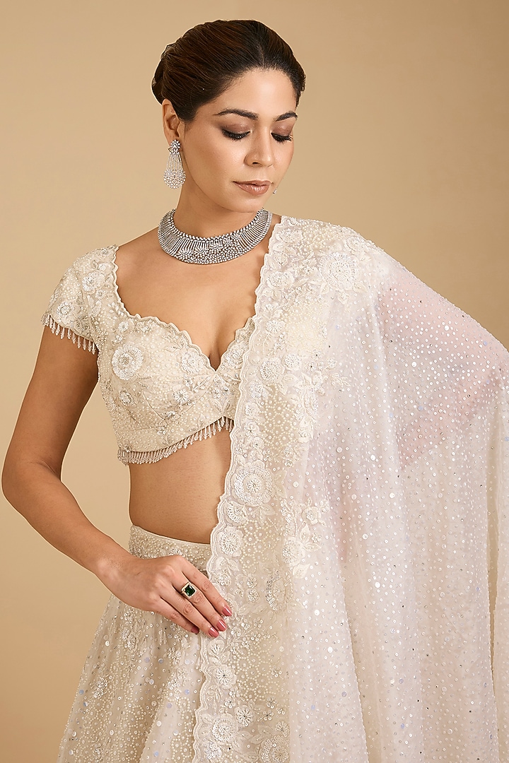 Ivory Organza Sequins Embroidered Bridal Lehenga Set by Vedant G at Pernia's Pop Up Shop