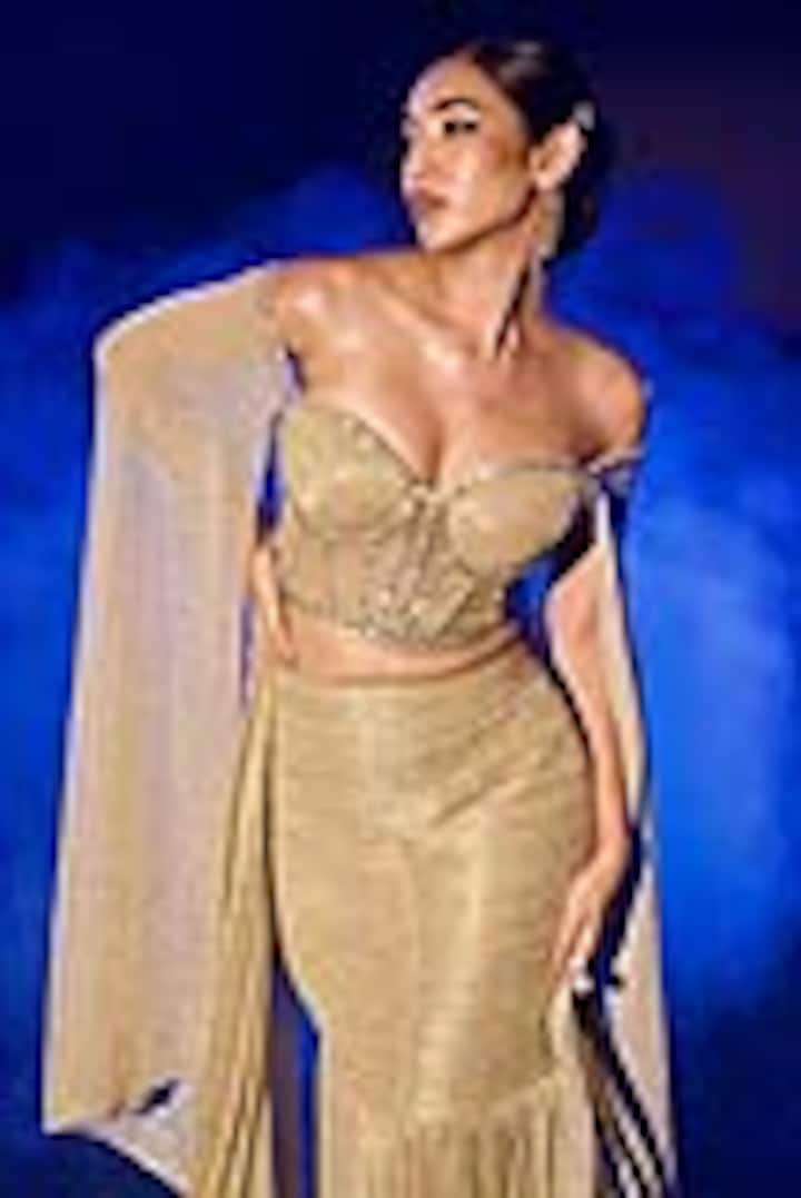 Golden Shimmer Pleated Lycra Fish Cut Skirt Set by Vesture at Pernia's Pop Up Shop