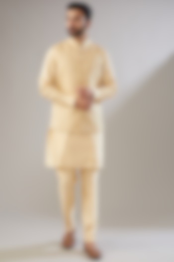 Gold Silk Kurta Set With Nehru Jacket by VICUGNA