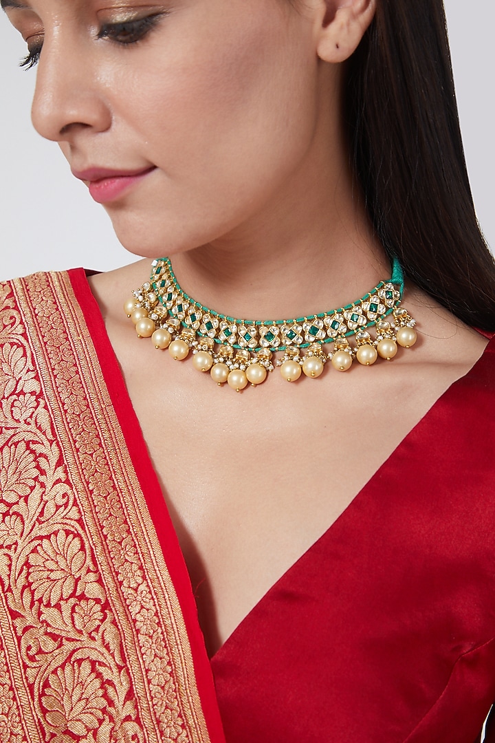 Gold Finish Kundan Polki & Emerald Choker Necklace In Sterling Silver by Vinanti Manji at Pernia's Pop Up Shop
