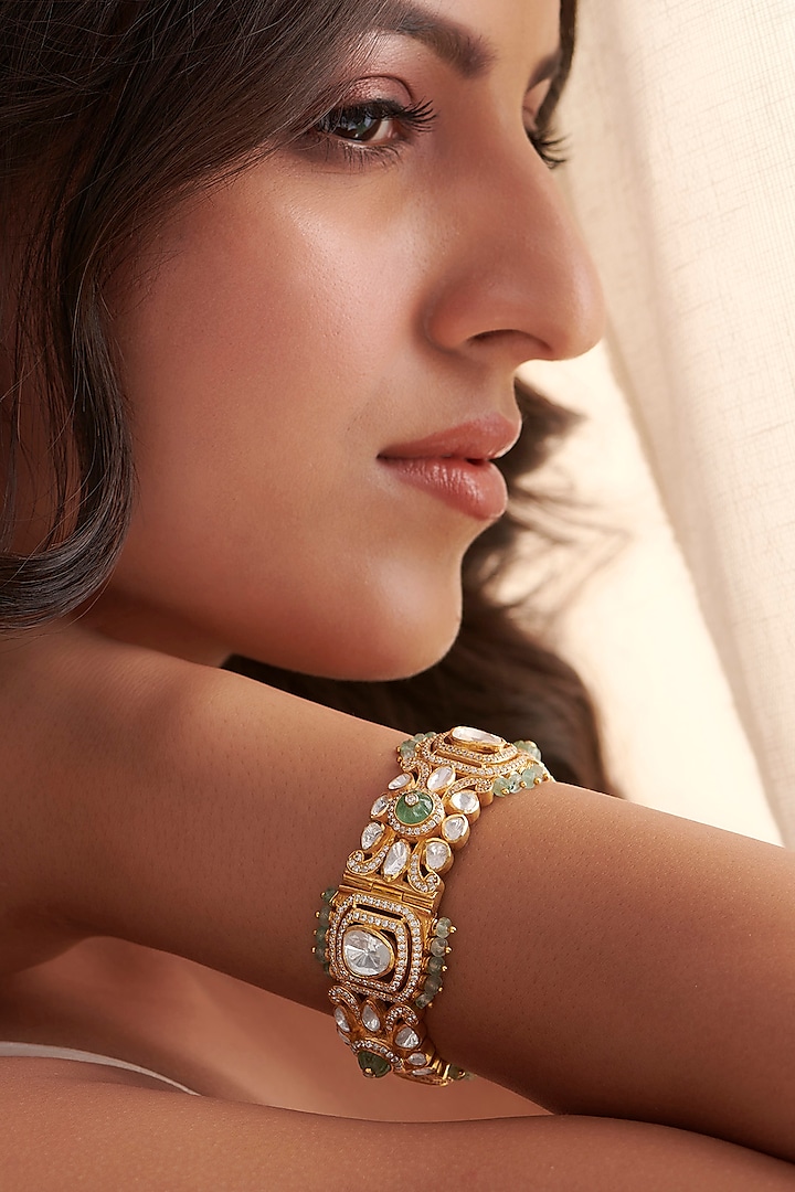 Gold Finish Green Stone & Kundan Polki Bangle In Sterling Silver by Vinanti Manji at Pernia's Pop Up Shop