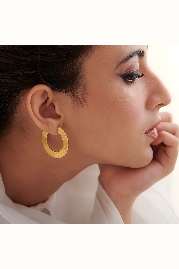 Gold Finish Hoop Earrings In Sterling Silver by Vinanti Manji at Pernia's Pop Up Shop