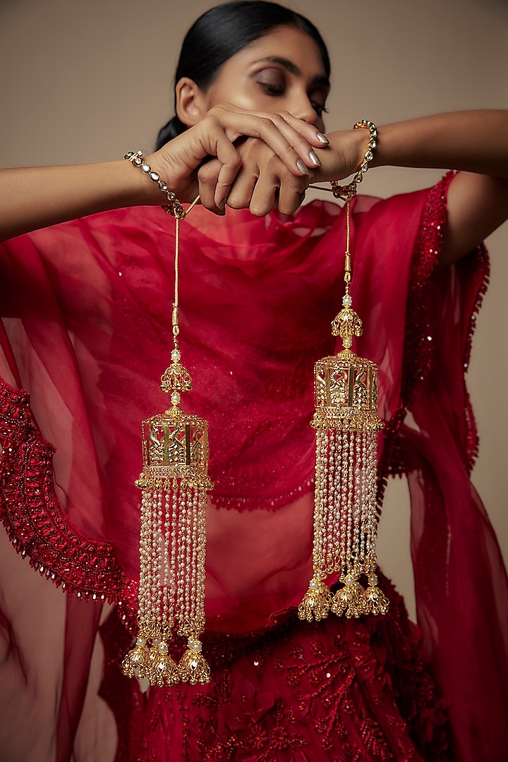 Gold Finish Pearl & Charm Tying Kaleeras (Set Of 2) by Vivinia By Vidhi Mehra