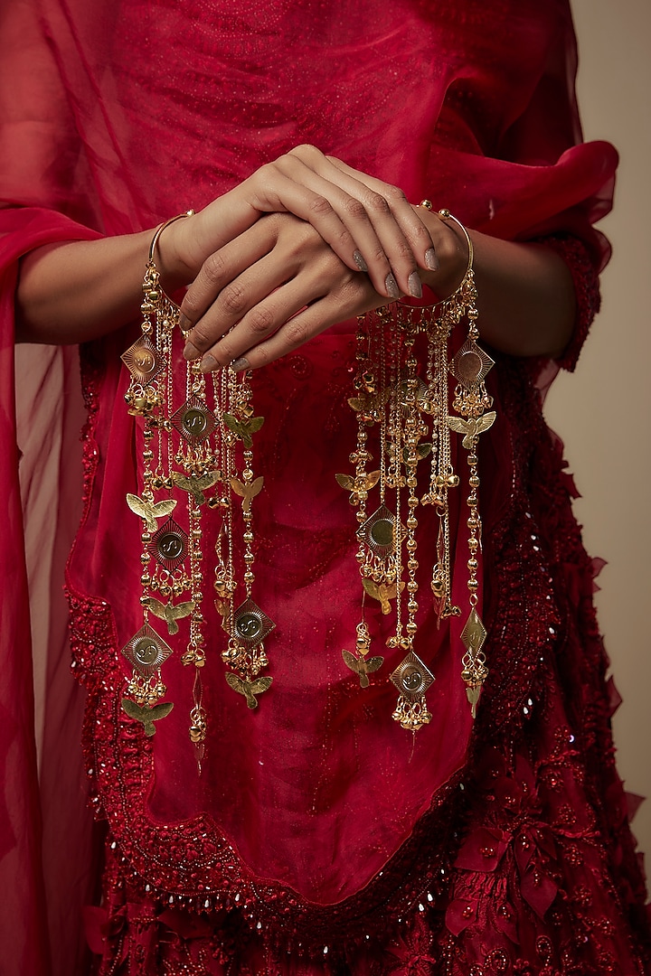 Gold Finish Hanging Charm Bangle Kaleeras (Set Of 2) by Vivinia By Vidhi Mehra