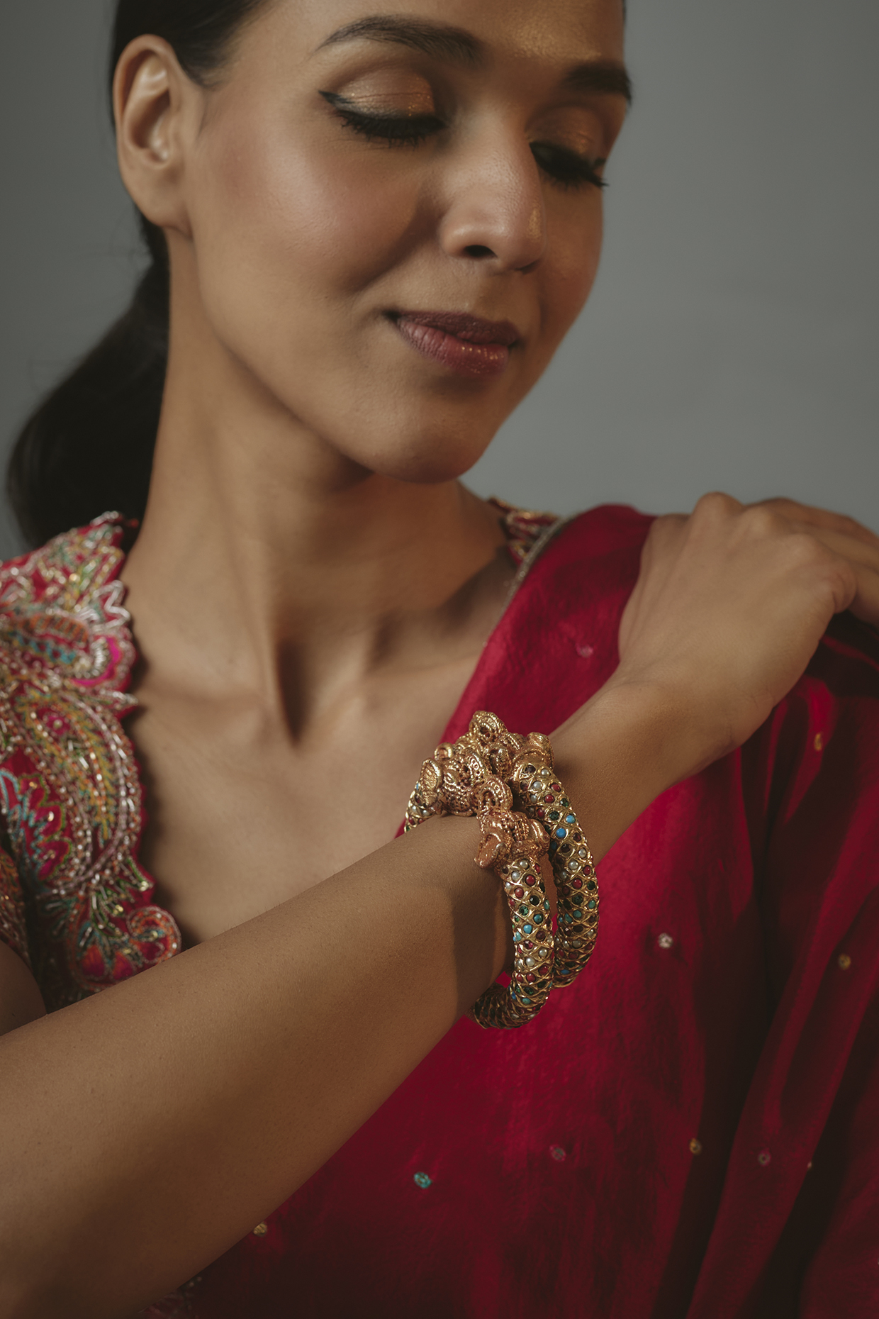 Gold Finish Onyx Stone Bangles (Set Of 2) by Vivinia By Vidhi Mehra at Pernia's Pop Up Shop