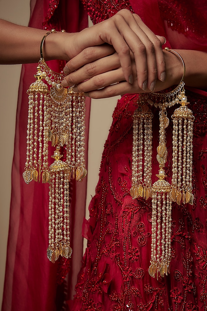 Gold Finish Pearl & Hanging Charm Tying Kaleeras (Set Of 2) by Vivinia By Vidhi Mehra